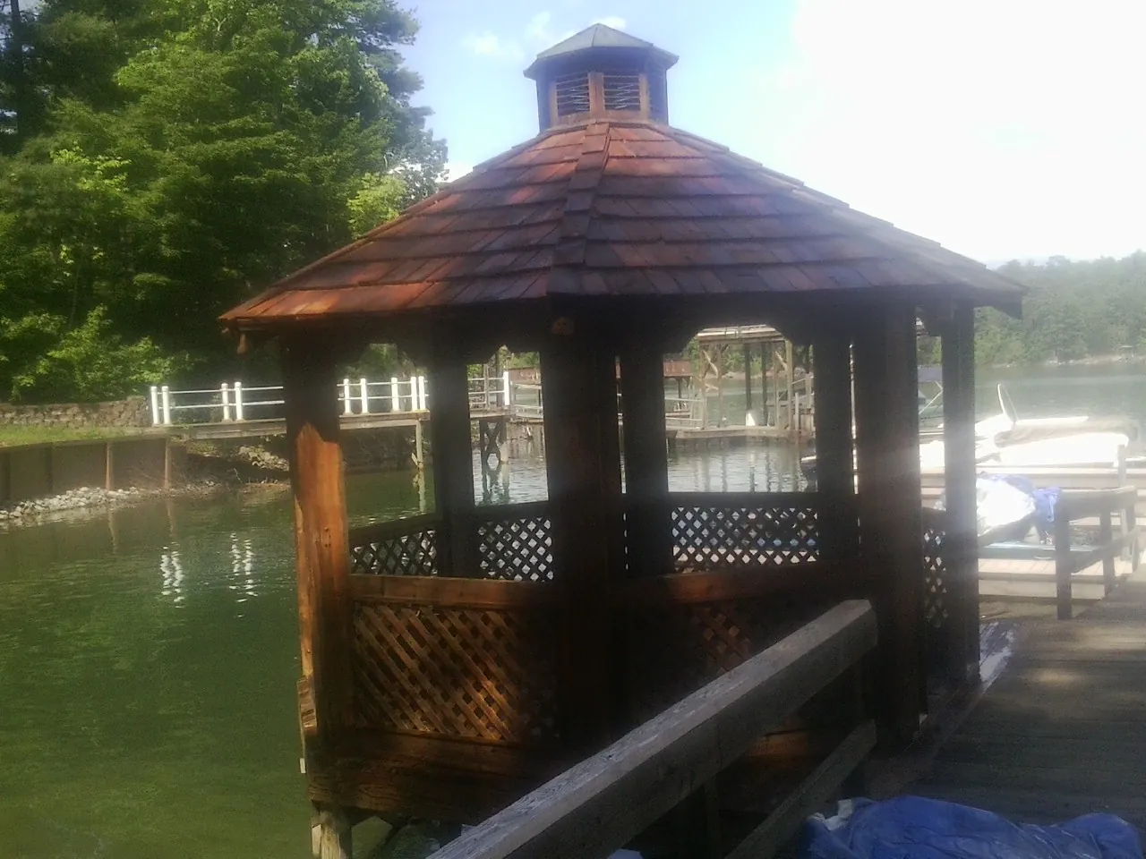 Cedar shake gazebo roof rebuilt on a lake dock in Weaverville